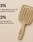 Beige hairbrush with 'Rosemary Hair Oil Co.' branding on a beige background, detangle brush, tangle teaser, flexi brush