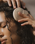 Person applying Rosemary Hair Oil Co. product to hair, Rosemary hair oil, scalp massager, soothe, essential, hair growth, stimulate, health, haircare, UK