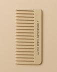Beige comb with 'Rosemary Hair Oil Co.' branding on a beige background, wide tooth flat comb,