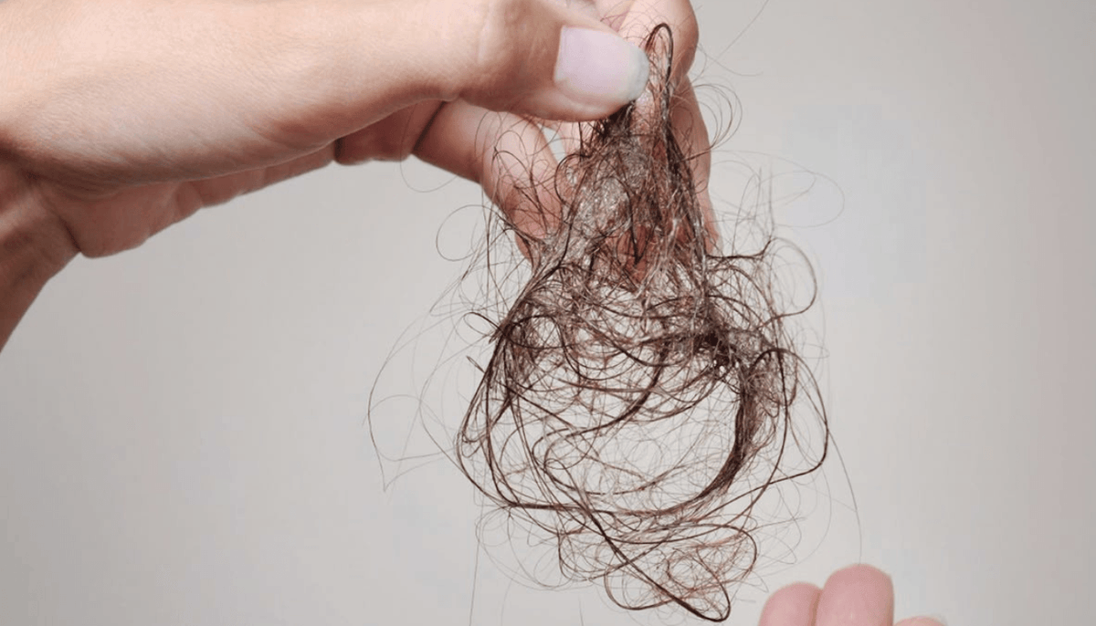Tackling Postpartum Hair Loss Naturally with Rosemary Hair Oil