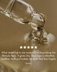 Rosemary Hair Oil Co. bottle on a stone platform with a neutral background. Rosemary hair oil, castor oil, camellia oil, apricot oil, hair growth, healthier, fuller-looking hair, stimulate, regrowth, hair thinning, natural, 100ml, review, 5 star