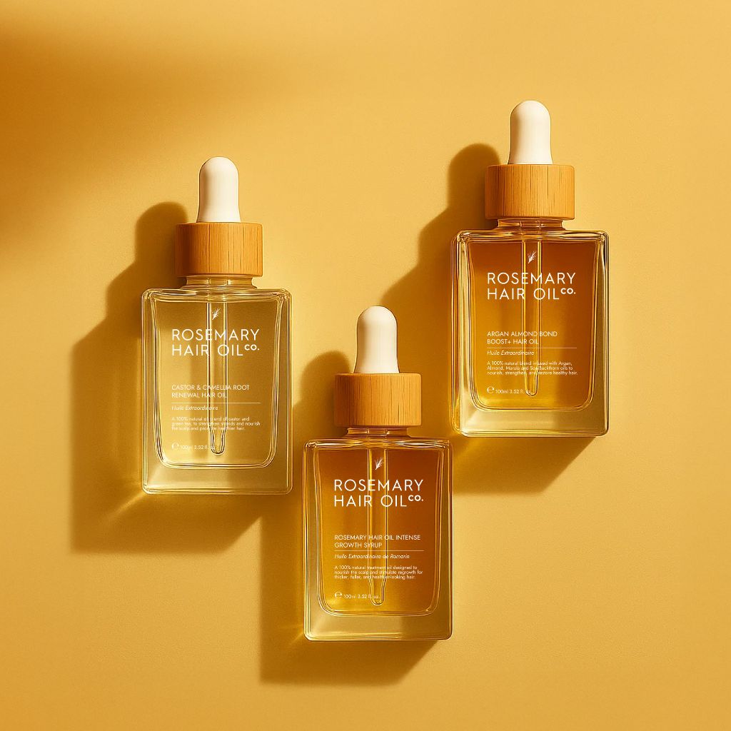 Three bottles of Rosemary Hair Oil Co. on a yellow background