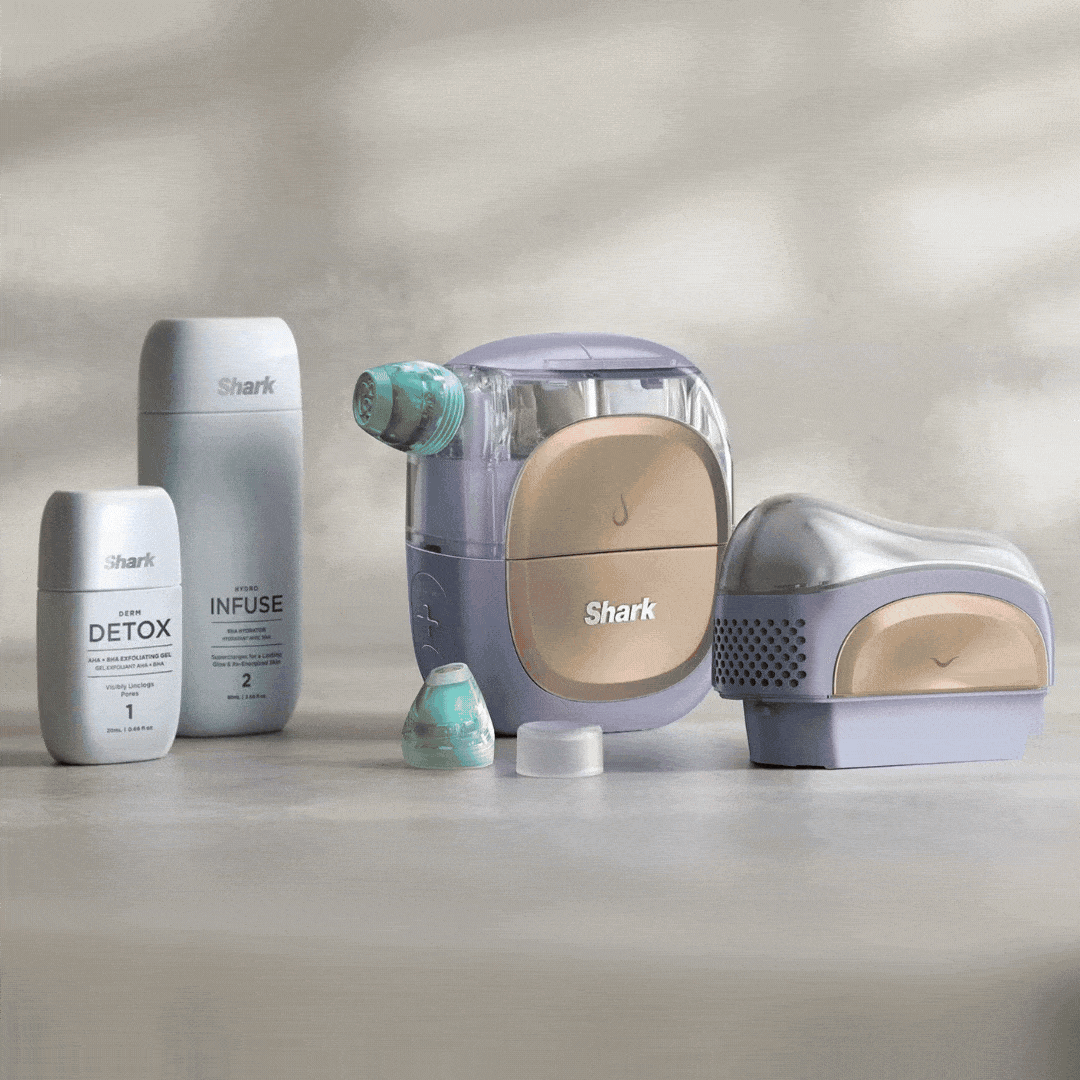 Win, giveaway, Shark skincare products including bottles and a device on a neutral background. Shark beauty prize bundle giveaway featuring the Shark Depuffi Contrast Therapy Sculpting Tool, Shark FacialPro Glow + Depuffi At Home Facial device, and Glow Detox + Hydrate Replenishment Set. The prize package highlights at-home facial treatments designed to help sculpt, depuff, hydrate and refresh the skin. 